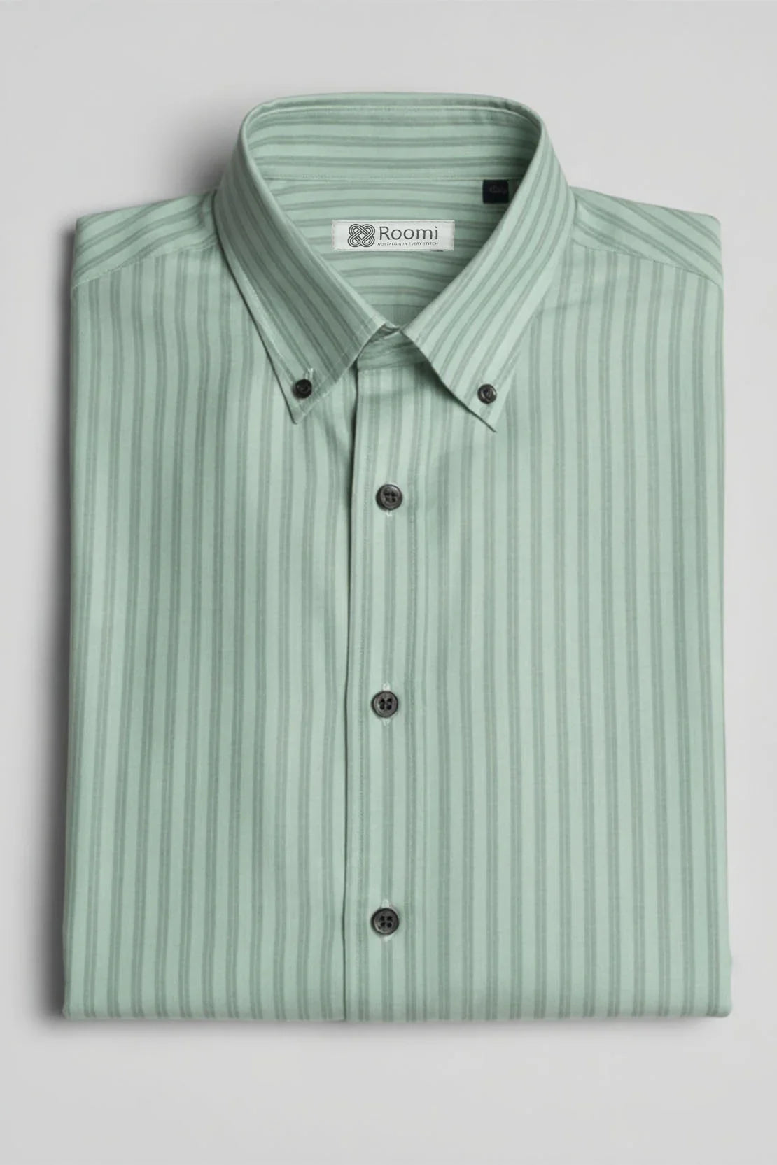 Folded mint green striped button-up dress shirt with button-down collar