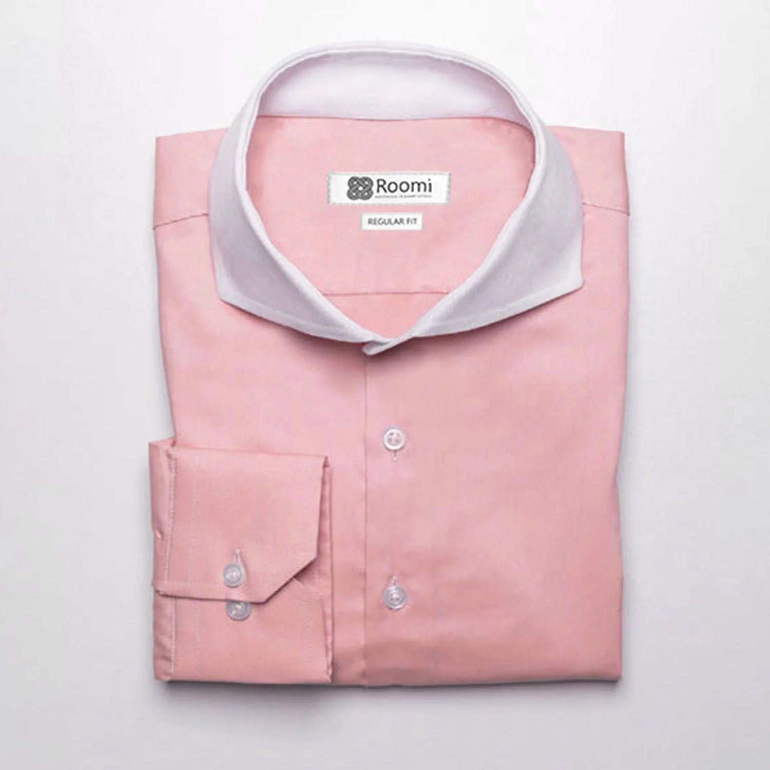 Pink men's dress shirt with white contrast collar, regular fit by Roomi, neatly folded on white background